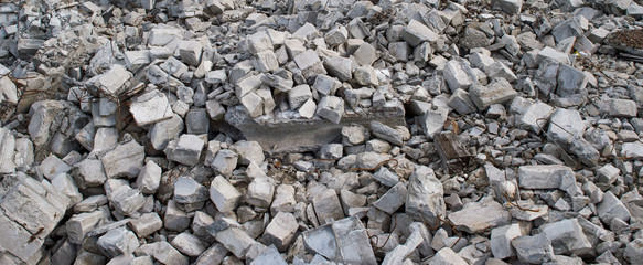 Gray fragments of silicate bricks with the remains of the solution after the demolition of the building wall. Background