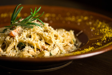 Delicious italian pasta on wooden background