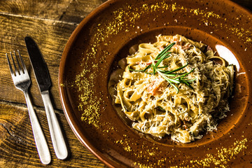 Delicious italian pasta on wooden background