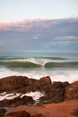 Powerful sea waves crushing to the rocks on the shore