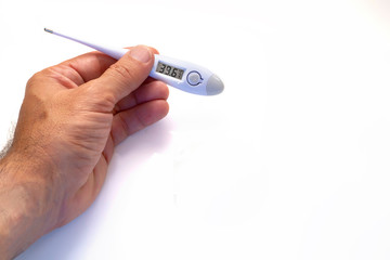hand with a digital thermometer showing fever values over white background