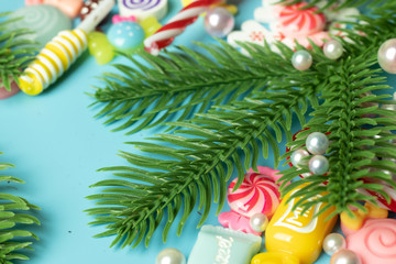 Christmas tree branch blue background with copy space