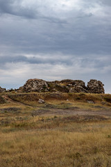 rocky steppe landscape on the background of a cloudy sky with clouds