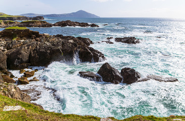 landscape of Waves crashing to rocky sea shore. Dramatc wild coast of achill island.