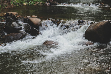 Fototapeta na wymiar Beautiful natural scenic of watercourse from waterfall in Thailand.