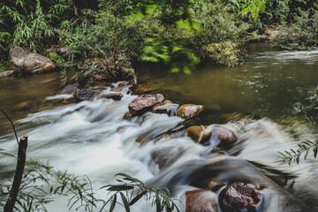 Beautiful natural scenic of watercourse from  waterfall in Thailand.