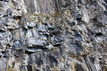 Texture of rock in the nature, a geological pattern. Background texture of gray stone