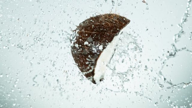 Super Slow Motion Shot of Water Splashing From Coconut Collision