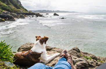 Relaxing with a dog over the ocean in Northern California
