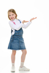 Little girl is showing a finger.The concept of advertising goods and services.