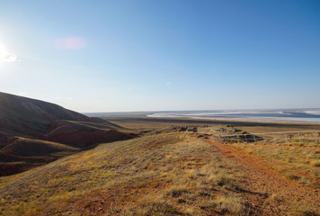 Big Bogdo mountain. Red Sandstone outcrops on the slopes of the sacred mountain in the Caspian...