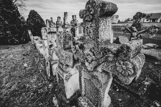Destroyed tombstones in an abandoned Ukrainian cemetery in Laszki