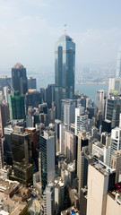 Fototapeta na wymiar Hong Kong / March 28 2018: Aerial view of Hong Kong city. Skyscrapers, office glass buildings business centers near Victoria harbour bay concrete jungle megalopolis cityscape city life. Sunny blue sky