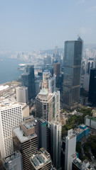 Fototapeta na wymiar Hong Kong / March 28 2018: Aerial view of Hong Kong city. Skyscrapers, office glass buildings business centers near Victoria harbour bay concrete jungle megalopolis cityscape city life. Sunny blue sky