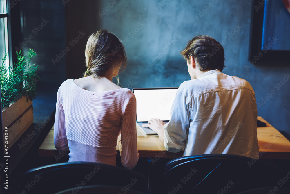 Poster back view of male and female freelance copywriters working togetherness for creating interesting con