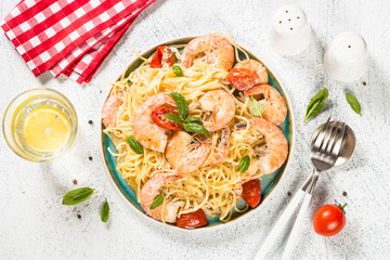 Pasta seafood with shrimp on white table.