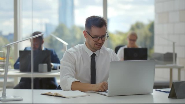 Young businessman concentrate on working with laptop computer at office