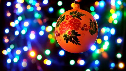 christmas ball on rainbow colored background