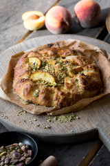 Appetite summer peach galeta on white table with copy space. summer open tart