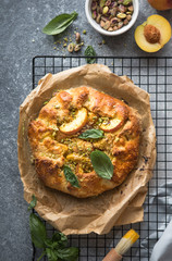 Appetite summer peach galeta on white table with copy space. summer open tart