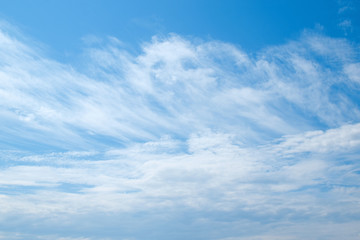 Naklejka na ściany i meble White clouds and blue sky. Blurred clouds background.