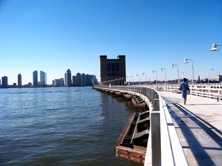 Concrete pier with tall lamps. Pier on the Hudson River