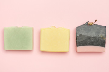 Handmade soap bars on pink background. Homemade toxic-free natural organic cosmetic