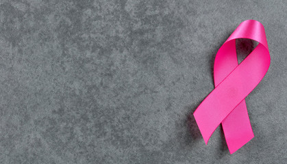 Breast cancer awareness pink sign symbol on isolated grey background. healthcare and medicine concept.
