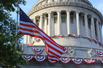 American flag waving next to the Memorial Capitol
