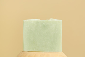 Handmade castile soap bar  close up. Homemade toxic-free natural organic cosmetic.