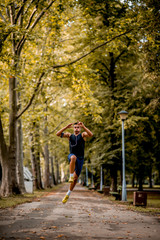 Fototapeta na wymiar Young Caucasian man jogging in the park