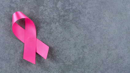 Breast cancer awareness pink sign symbol on isolated grey background. healthcare and medicine concept.