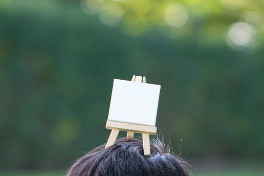 child with blank canvas