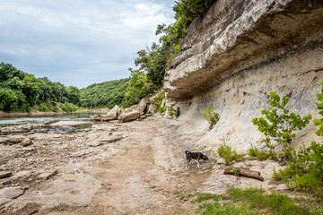 limestone wall beside a river