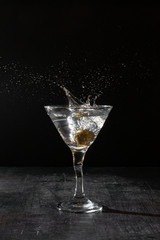 martini with splash on black