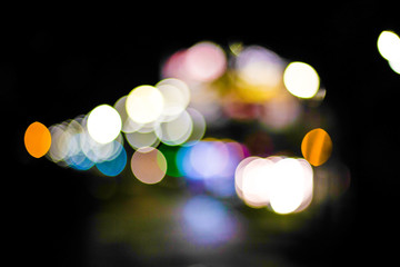 Obraz premium Blurred background of colorful circles at night