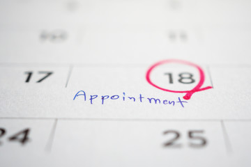 important appointment schedule write on white calendar page date close up