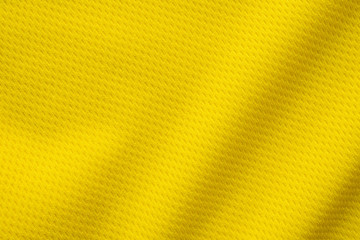 Yellow sports clothing fabric football shirt jersey texture close up