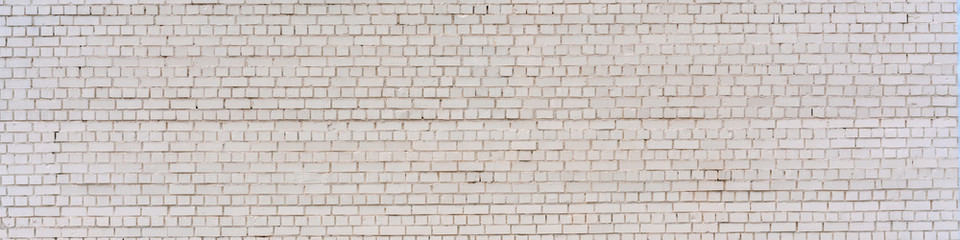 Fototapeta premium panoramic shot of large white brick wall with copy space