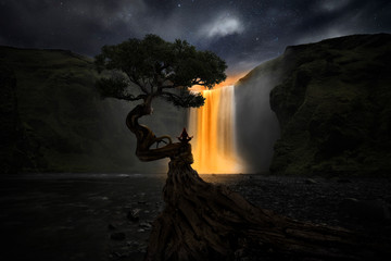 Woman doing yoga in front of a magic waterfall