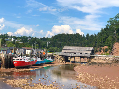 Colorful  fishing boats at low tide in New Brunswick Canada