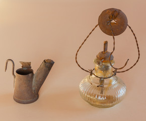 a light and a lamp old / close-up of an ancient light to work at the mine and an antique lamp to work in the fields
