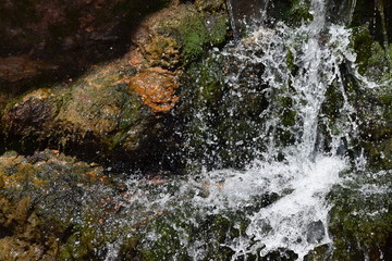 Splashing waterfall on rock