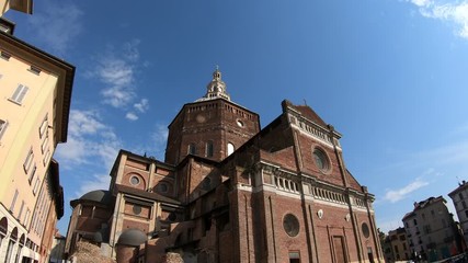 4K vertical tilt shot of the beautiful Pavia Cathedral (Duomo di Pavia) during a sunny summer day  - Powered by Adobe