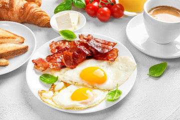 Traditional american breakfast with bacon and eggs
