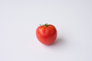 red tomato on a white background