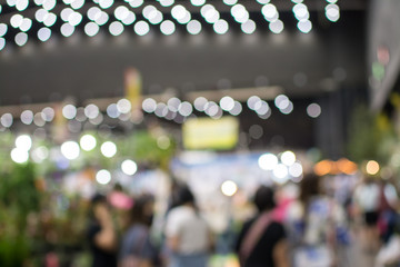Abstract people walking in exhibition blurred background