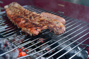 Pork ribs grilled over the coals. Concept of food. Copy space.