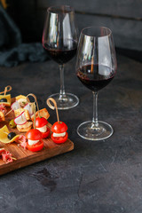 glass of wine and a snack canapes cheese plate serving size natural product portion top view place for text copy space