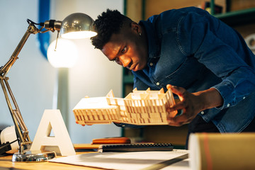 Architect young man working in your project.